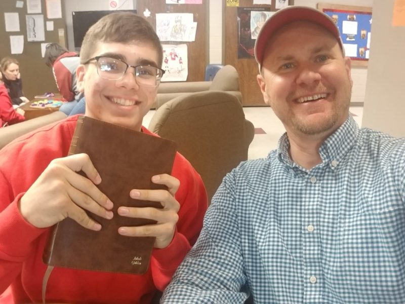 Tyler gives kid bible through JJM