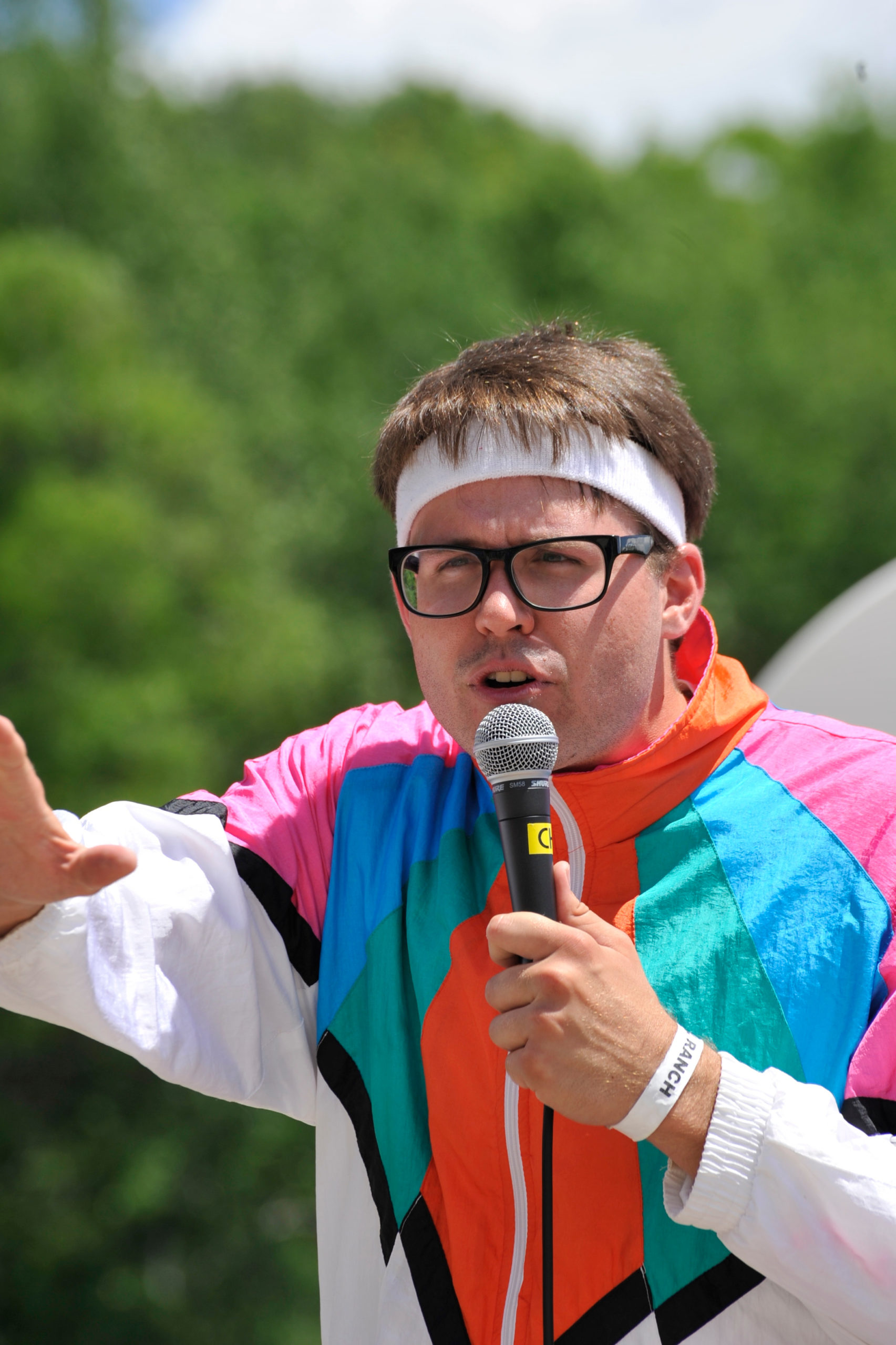 Jason give instructions to kids in a track suit